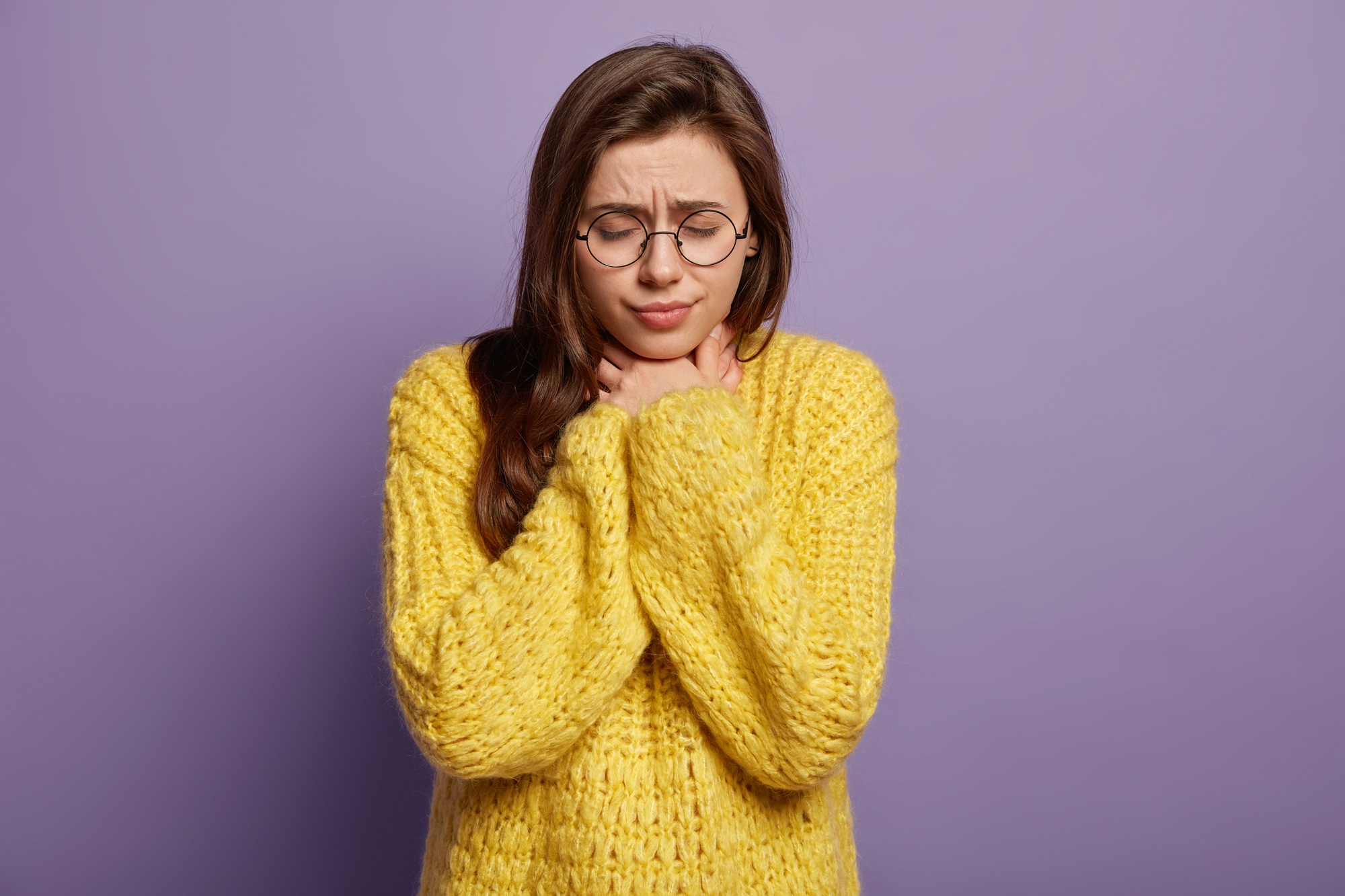 Cold again. Upset woman feels inflammation, keeps eyes shut, feels discomfort caused by illness, has